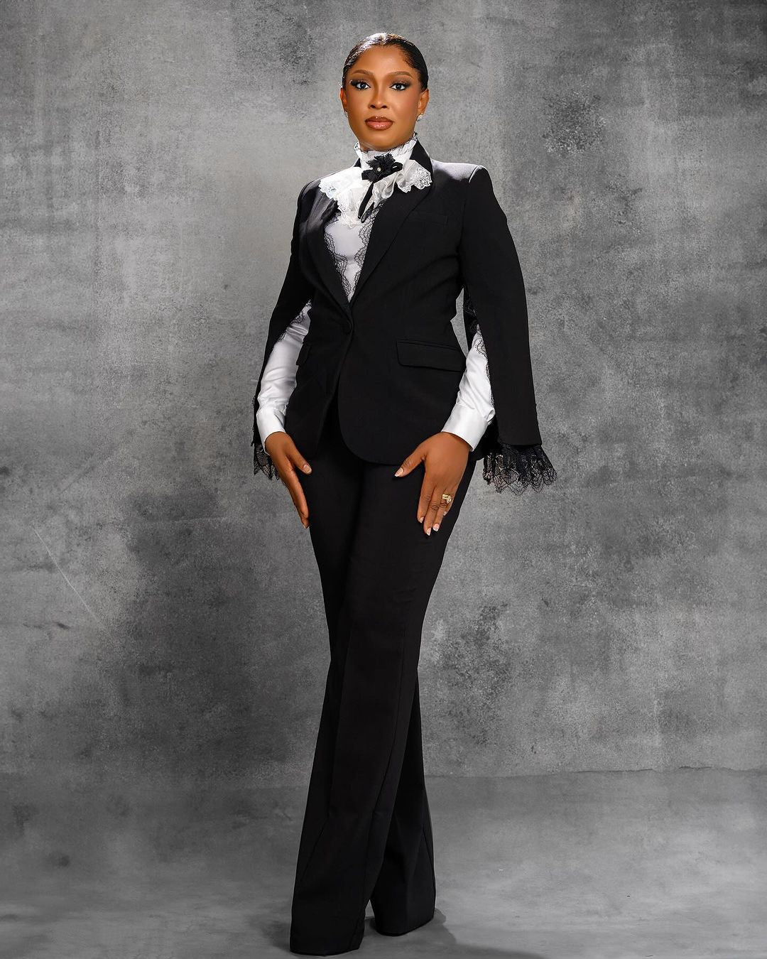 Classic two-piece lace blazer and pant set, tailored for the mother of the bride or wedding guest.