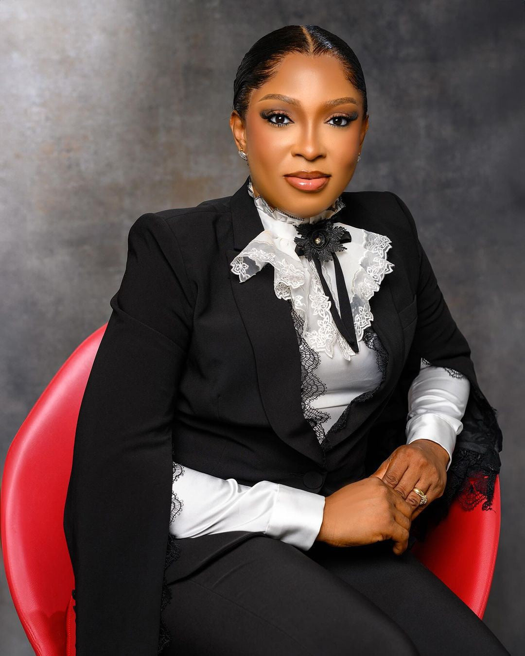 Classic two-piece lace blazer and pant set, tailored for the mother of the bride or wedding guest.